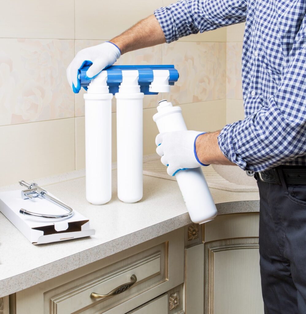 plumber installing water filtration