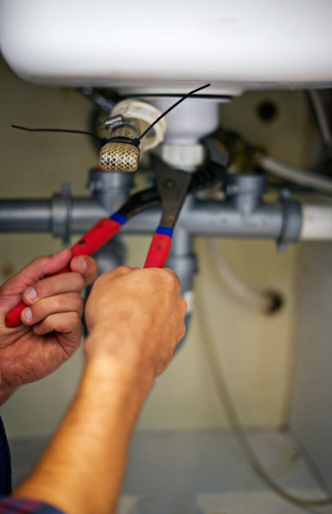 plumber fixing pipes