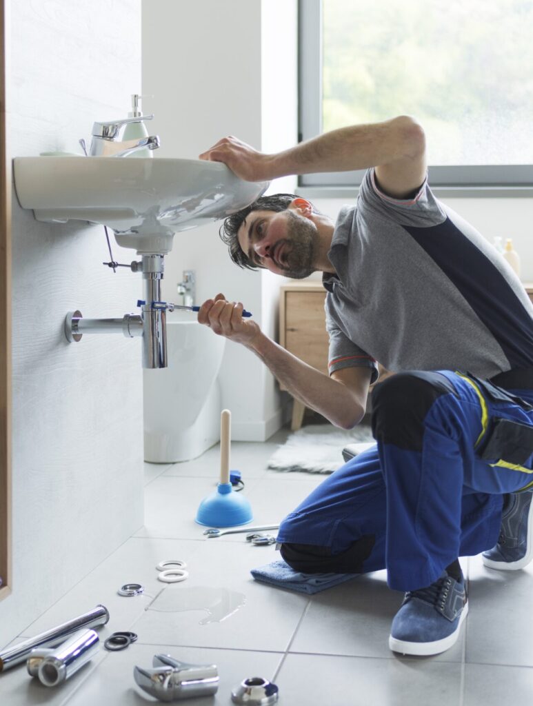 professional plumber fixing pipes