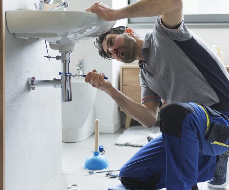 Professional,Plumber,Checking,Drain,Pipes,At,Home,And,Using,Pliers professional plumber fixing pipes